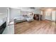 Living room with a fireplace, modern sofa, and open access to the entry at 1192 Sandalwood Dr, Lawrenceville, GA 30043