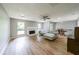 Spacious living room featuring a fireplace, hardwood floors, and natural light at 1192 Sandalwood Dr, Lawrenceville, GA 30043
