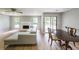 Living room featuring a fireplace, hardwood floors, and sliding glass doors to the deck at 1192 Sandalwood Dr, Lawrenceville, GA 30043