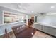 Open-concept living space with kitchen access and dining area and hardwood floors at 1192 Sandalwood Dr, Lawrenceville, GA 30043