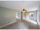 Spacious main bedroom with sliding barn door entry to bathroom, large window, and neutral carpet at 1192 Sandalwood Dr, Lawrenceville, GA 30043