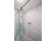 Beautiful updated shower with glass door and decorative marble-look tile and mosaic floor at 1192 Sandalwood Dr, Lawrenceville, GA 30043