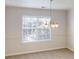 Dining room featuring a chandelier and natural light from the window at 150 Mills Creek Ln, Covington, GA 30016