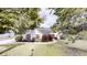 Charming single-story home with well-manicured lawn and mature trees at 150 Mills Creek Ln, Covington, GA 30016