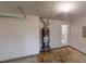 Spacious garage featuring a water heater and visible access to the home's interior at 150 Mills Creek Ln, Covington, GA 30016