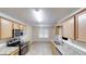 Bright kitchen features stainless appliances, granite counters, and ample cabinet space at 150 Mills Creek Ln, Covington, GA 30016