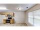 Eat-in kitchen features updated stainless steel appliances and light wood cabinetry at 150 Mills Creek Ln, Covington, GA 30016