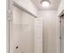 Bright laundry room with white walls, shelving, and washer/dryer connections at 150 Mills Creek Ln, Covington, GA 30016