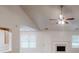 Bright living room features vaulted ceilings, fireplace, and neutral decor at 150 Mills Creek Ln, Covington, GA 30016