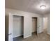 Bedroom featuring two closets with open doors revealing ample storage space at 2530 Flippen Rd, Stockbridge, GA 30281