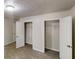 Bedroom featuring two closets with open doors revealing ample storage space at 2530 Flippen Rd, Stockbridge, GA 30281