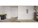 A spacious garage with ample storage space also including a water heater and trash bin at 2530 Flippen Rd, Stockbridge, GA 30281