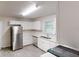 Bright kitchen featuring stainless steel appliances, white cabinets, and lots of natural light at 2530 Flippen Rd, Stockbridge, GA 30281