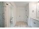 Bright bathroom featuring marble floors, a walk-in shower, and modern vanity at 2732 Eagles Crest Ln, Decatur, GA 30034