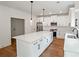 Spacious kitchen features a center island, stainless appliances, and pendant lighting at 2732 Eagles Crest Ln, Decatur, GA 30034