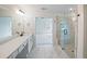 Main bath featuring an over-sized shower with a bench and dual vanity with quartz countertops at 2732 Eagles Crest Ln, Decatur, GA 30034