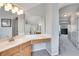 Bathroom featuring a large vanity, soaking tub area, and a view of the hallway at 3783 Wickford Ln, Peachtree Corners, GA 30096