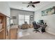 Bedroom with a ceiling fan, a large window, a workstation, and a cozy vibe at 3783 Wickford Ln, Peachtree Corners, GA 30096