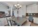 Open-concept dining area is adjacent to the kitchen and living room in an open floor plan at 3783 Wickford Ln, Peachtree Corners, GA 30096