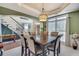 Elegant dining room with a tray ceiling, large table, and abundant natural light at 3783 Wickford Ln, Peachtree Corners, GA 30096