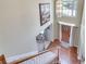 Bright foyer featuring hardwood floors, a decorative chandelier, and a staircase leading to the upper level at 3783 Wickford Ln, Peachtree Corners, GA 30096