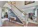 Elegant foyer showcasing a staircase, hardwood floors, and views into other living spaces at 3783 Wickford Ln, Peachtree Corners, GA 30096