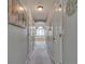Hallway with white trim and neutral paint leads to the main bathroom with natural light at 3783 Wickford Ln, Peachtree Corners, GA 30096