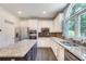 Modern kitchen features stainless steel appliances, granite countertops, and a center island at 3783 Wickford Ln, Peachtree Corners, GA 30096