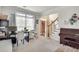 Inviting living room with natural light, neutral tones, a work area and staircase with wood railing at 3783 Wickford Ln, Peachtree Corners, GA 30096