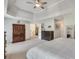 A spacious main bedroom offers a tray ceiling, ceiling fan, and a large walk-in closet at 3783 Wickford Ln, Peachtree Corners, GA 30096