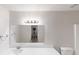 Bathroom with a large mirror, bright lighting, and a spacious vanity at 765 Stonebridge Run, Lithonia, GA 30058