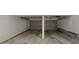 Spacious garage with concrete floor and storage at 765 Stonebridge Run, Lithonia, GA 30058