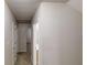 Hallway with neutral walls and doors leading to various rooms at 765 Stonebridge Run, Lithonia, GA 30058