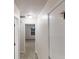 Well-lit hallway featuring neutral tones and access to multiple rooms at 765 Stonebridge Run, Lithonia, GA 30058