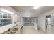 Bright kitchen featuring granite countertops, stainless steel appliances, and modern cabinets at 765 Stonebridge Run, Lithonia, GA 30058