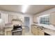 Kitchen with stainless steel appliances, granite countertops, and light wood cabinetry at 765 Stonebridge Run, Lithonia, GA 30058