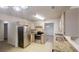 Well-lit kitchen with stainless steel appliances and granite countertops at 765 Stonebridge Run, Lithonia, GA 30058