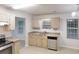 Well-lit kitchen with stainless steel appliances at 765 Stonebridge Run, Lithonia, GA 30058