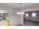 Open living space with tile floors, view of the Gathering room, and stainless steel refrigerator at 765 Stonebridge Run, Lithonia, GA 30058