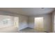Open-concept space with neutral paint, carpeted floors, and a chandelier in the dining area at 765 Stonebridge Run, Lithonia, GA 30058