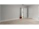 Spacious bedroom with carpet, classic trim, and entryways for easy access at 980 Pine Grove Rd, Roswell, GA 30075