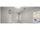 Cozy bedroom with natural light streaming through two windows and classic trim at 980 Pine Grove Rd, Roswell, GA 30075