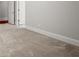 Neutral bedroom features plush carpet, two doors, and classic trim at 980 Pine Grove Rd, Roswell, GA 30075