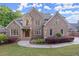Charming two-story brick home with manicured landscaping and a welcoming entrance at 980 Pine Grove Rd, Roswell, GA 30075