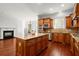 Kitchen features dark wood cabinets, granite countertops, stainless appliances, and large island at 980 Pine Grove Rd, Roswell, GA 30075