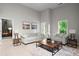 Inviting living room featuring stylish sofas, a modern coffee table, and natural light at 980 Pine Grove Rd, Roswell, GA 30075