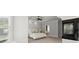 The primary bedroom boasts a tray ceiling, fireplace, and seamless access to the bathroom at 980 Pine Grove Rd, Roswell, GA 30075