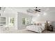 A spacious bedroom is brightened by natural light and adorned with tasteful décor at 980 Pine Grove Rd, Roswell, GA 30075