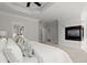 Primary bedroom showcases a cozy fireplace and elegant crown molding and baseboards at 980 Pine Grove Rd, Roswell, GA 30075