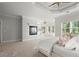 The primary bedroom offers a luxurious feel with a tray ceiling and fireplace at 980 Pine Grove Rd, Roswell, GA 30075